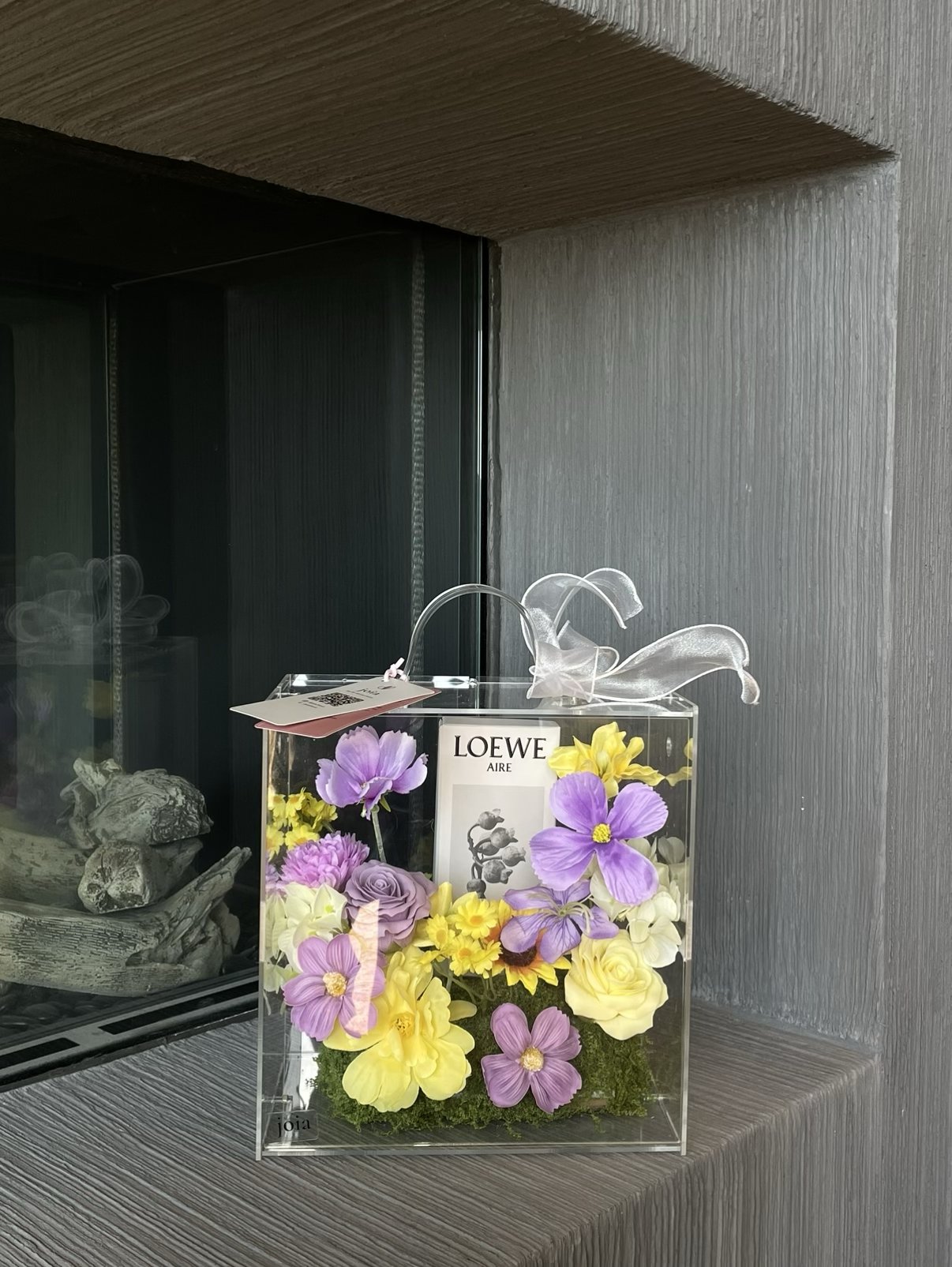 Purple and yellow JOIA flower valise with a personal gift inside