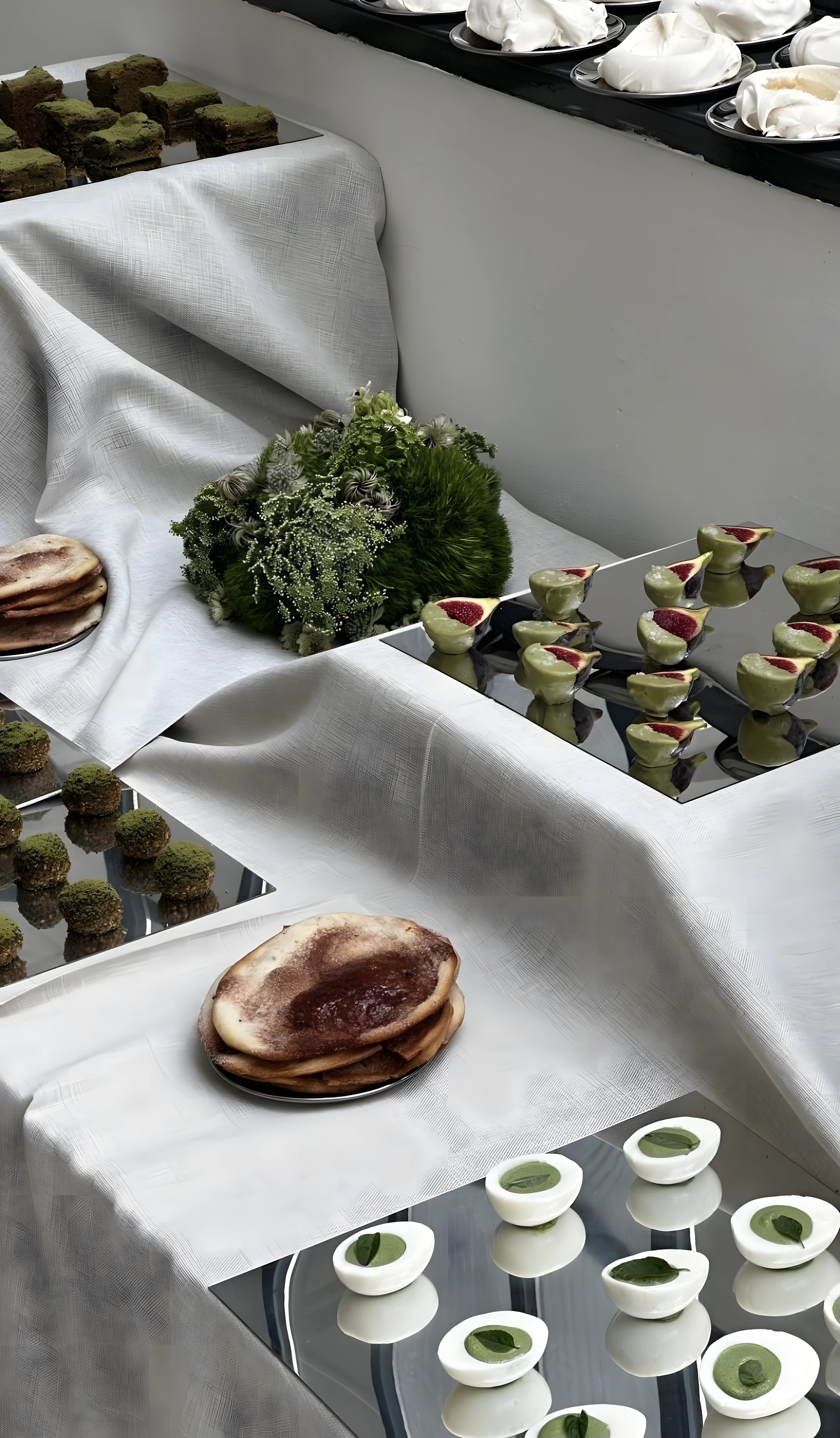 Artful grazing table with sculptural green florals
